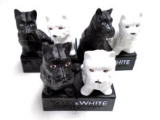 Three cast iron ornaments, Black & White scotch whisky.