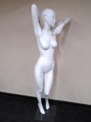 A female shop mannequin.