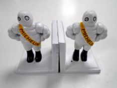 A pair of cast iron Michelin bookends.