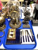 A tray containing a pair of 19th century wheat sheath door stops, cribbage board,