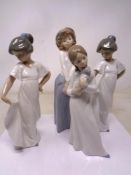 Four Nao figures including girl with puppy.
