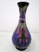 A Moorcroft Collector's Club Fuchsia bud vase (height 17cm).