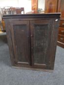 A 19th century oak double door hanging corner cabinet.
