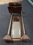 An Edwardian mahogany bevel edged mirror in oval frame together with two vintage copper headed poss