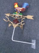 A cast iron cockerel weather vane with will mount.