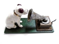 A cast iron figure HMV Nipper with gramophone.