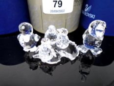 Three Swarovski crystal ornaments, penguin chicks and two ducks.