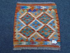 A Chobi kilim 49 cm x 50 cm