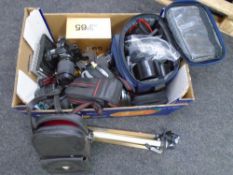 A box containing camera equipment including Chinon CP-7 camera with lens, Nikon F65 camera,