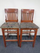 A set of three contemporary bar stools.