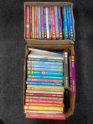 Two boxes containing a quantity of Haynes car manuals.