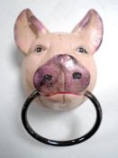 A cast iron pigs head horse hitch.