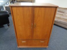 A 20th century teak G-plan television cabinet.