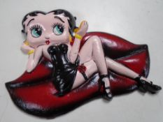 A cast iron plaque, Betty Boop.