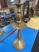 A 19th century Turkish brass candlestick (height 63cm).