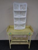 A rustic two tier painted lemonade stand together with a four tier whatnot stand.
