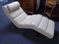 A contemporary cream leather chaise longue.
