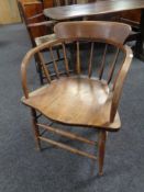 An Edwardian beech desk armchair.
