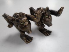 A pair of cast iron comical gorilla bookends.