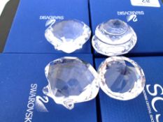 Four Swarovski crystal ornaments, shells and prism.