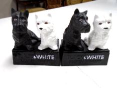 A pair of cast iron ornaments, Black & White scotch whisky.