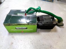 A Qualcast 1300W electric mower in box together with a Qualcast strimmer CONDITION