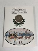 A commemorative 50p piece issued for the Pobjoy Mint, Christmas 1980.