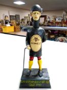 A cast iron Guinness money box.