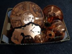 A box containing a quantity of African tourist copper ware including wall clocks, plaques, shields,