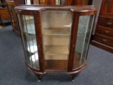 A 1930's walnut Art Deco display cabinet.