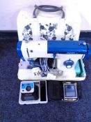 A 20th century Jones electric sewing machine in case together with a Kodak camera and a SatNav.