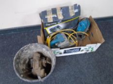 A box containing Wolf 110v planer, Makita router,