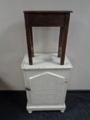 An antique painted cabinet together with a carved oak stool.