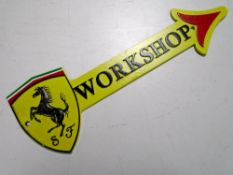 A cast iron wall plaque, Ferrari workshop.