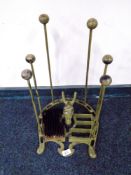 A cast iron horse head boot rack with bootjack and scraper.