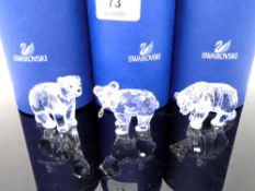Three Swarovski crystal ornaments, bear cubs.