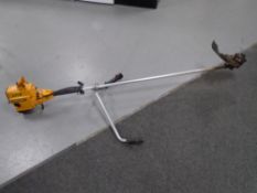 A Partner B325 petrol brush cutter.