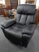 A contemporary electric reclining armchair.