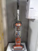 A Shark upright vacuum.