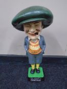 A cast iron figure, Penfold golfer.