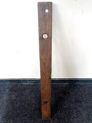 A vintage wooden spirit level.