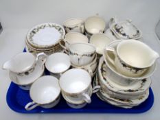 A tray containing two part tea services, Royal Stafford Romana and Alfred Meakin.