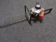 A Mitsubishi petrol hedge cutter.