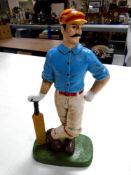 A cast iron door stop, cricketer.