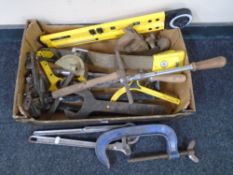 A box containing assorted tools including Record G-clamp, planes, oversized spanners,