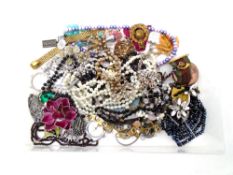 A plastic tub containing a quantity of assorted costume jewellery, contemporary pocket watch,