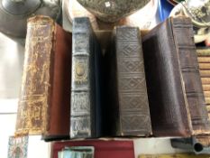 A 19th century leather bound photograph album together with three further volumes Punch 1900,