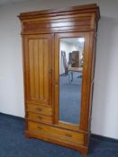 An Edwardian pitch pine gentleman's wardrobe.