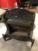 An antique cast iron fireplace.