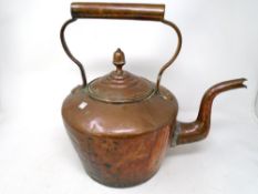 A Victorian copper kettle.